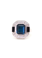 Bague art déco en argent ornée d'une pierre bleue