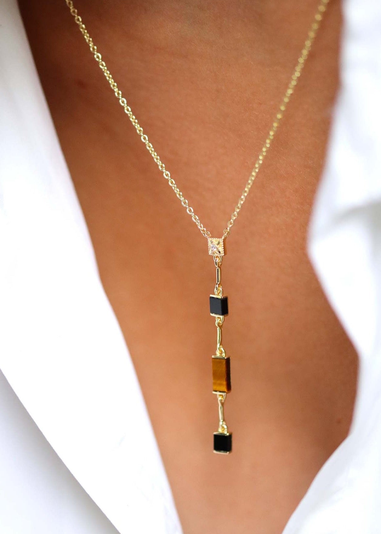 Collier Y plaqué or avec oeil de tigre et onyx noir