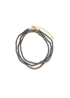 collier long fin en perles d'hématite facettée