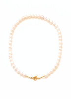 collier en perles d'eau douce avec un fermoir bouée pour accrocher un fermoir