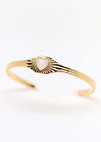 Jonc doré avec un coeur en cabochon